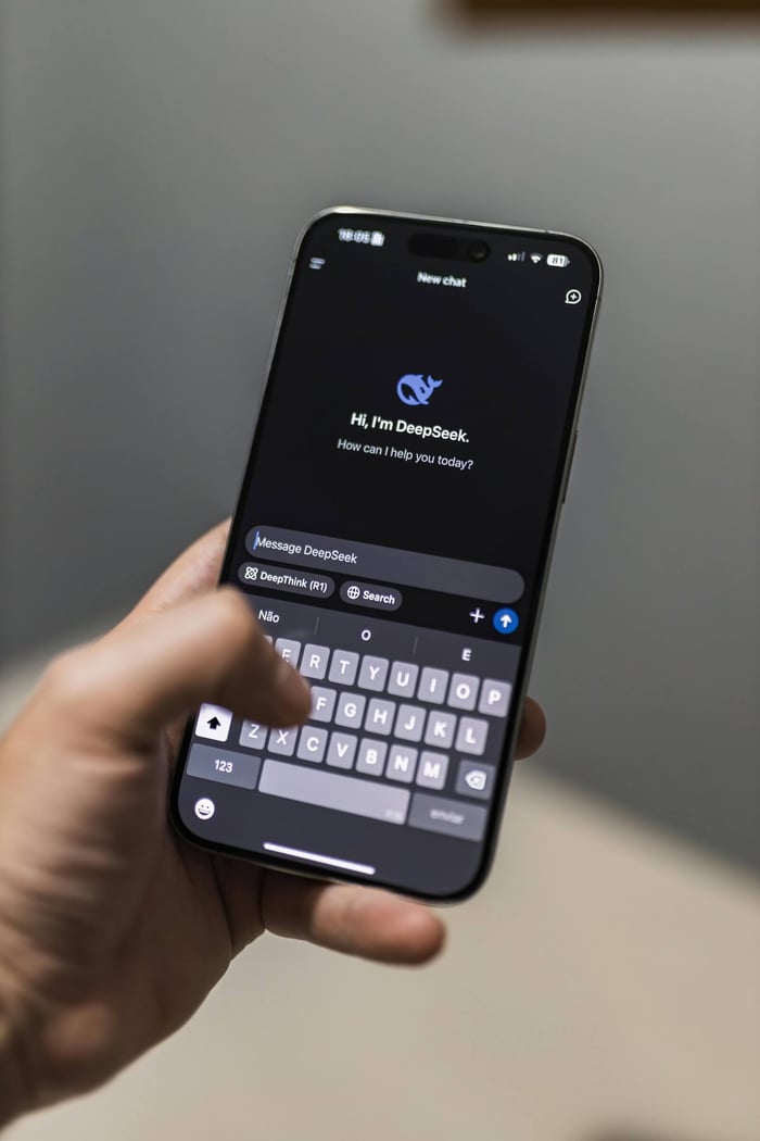 Close-up of a smartphone with an AI chat interface titled 'DeepSeek' on the screen.