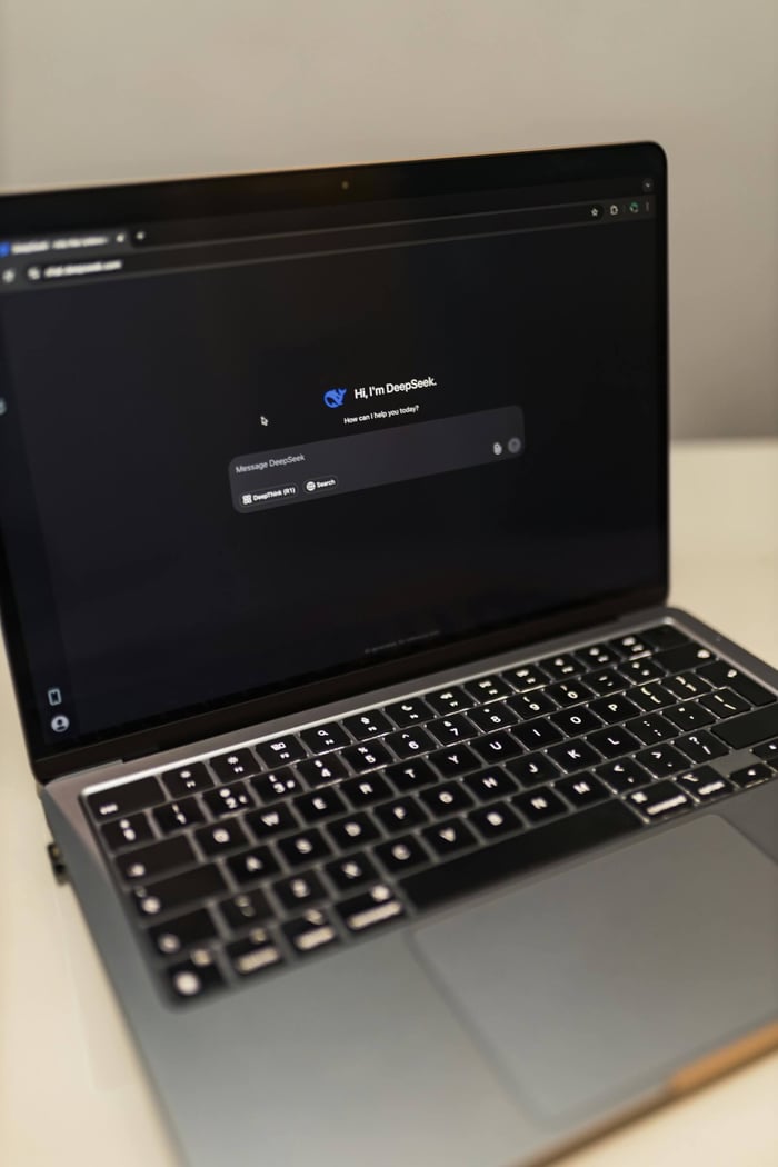e-commerce store owner looking at a complex schema markup code snippet on a screen, representing the technical challenge of structured data for AI visibility